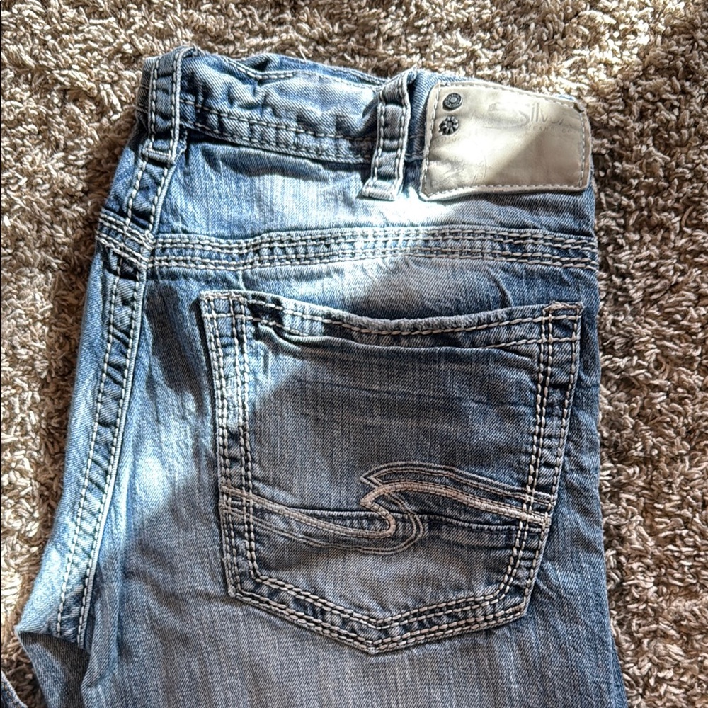 Blue Bootcut Jeans with Distressed Details